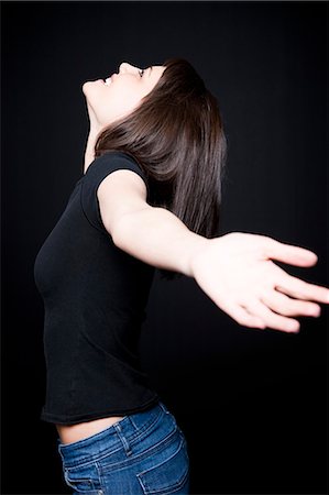 simsearch:640-03257317,k - Woman with outstretched arms Fotografie stock - Premium Royalty-Free, Codice: 640-03256992