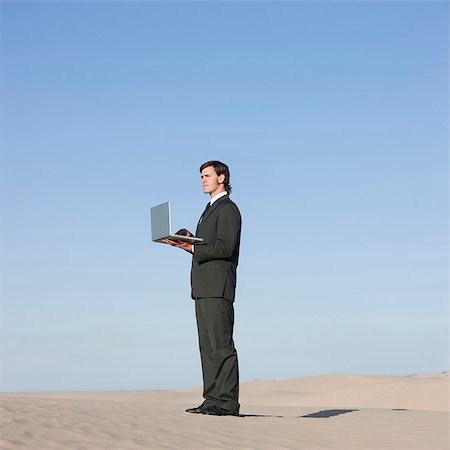 simsearch:640-03257097,k - USA, Utah, Little Sahara, businessman looking through telescope in desert Stock Photo - Premium Royalty-Free, Code: 640-03257030