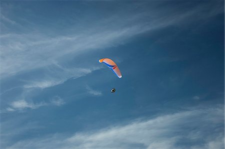 paragliding extreme sport - USA, Utah, Lehi, young man paragliding, low angle view Stock Photo - Premium Royalty-Free, Code: 640-03257099