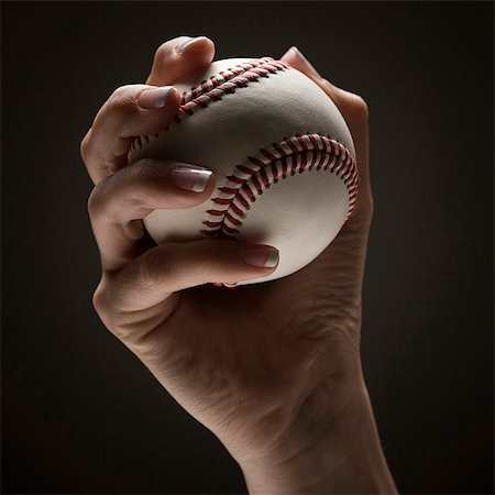 simsearch:640-03257126,k - Young woman's hand holding baseball Fotografie stock - Premium Royalty-Free, Codice: 640-03257125