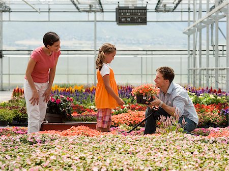 USA, Utah, Salem, girl (8-9) with parents choosing plants in greenhouse Stock Photo - Premium Royalty-Free, Code: 640-03257157