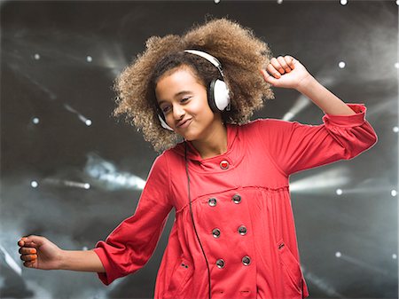 preteen dancing - Girl (12-13) dancing with headphones Stock Photo - Premium Royalty-Free, Code: 640-03257194