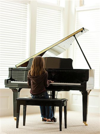 people in mountain home - USA, Utah, Alpine, girl (8-9) practicing piano, rear view Stock Photo - Premium Royalty-Free, Code: 640-03257226