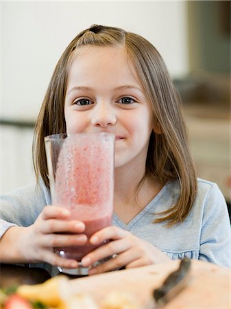 people in mountain home - USA, Utah, Alpine, girl (8-9) holding smoothie Stock Photo - Premium Royalty-Free, Code: 640-03257220