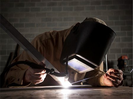 USA, Utah, Orem, welder using torch Foto de stock - Sin royalties Premium, Código: 640-03257238