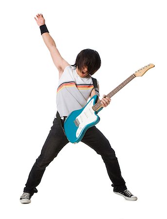 Young man playing electric guitar Stock Photo - Premium Royalty-Free, Code: 640-03257248