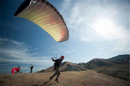 parachute - USA, Utah, Lehi, young paraglider starting from hill Stock Photo - Premium Royalty-Free, Code: 640-03257435