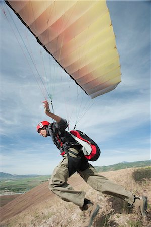 parachute - USA, Utah, Lehi, young paraglider starting from hill Stock Photo - Premium Royalty-Free, Code: 640-03257438
