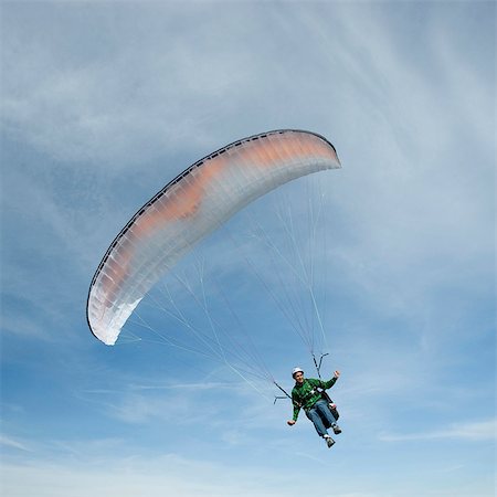 paragliding extreme sport - USA, Utah, Lehi, low angle view of young paraglider Stock Photo - Premium Royalty-Free, Code: 640-03257439