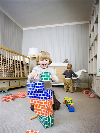 simsearch:640-03257551,k - USA, Utah, Provo, Two boys (18-23 months,2-3) playing with building blocks Stock Photo - Premium Royalty-Free, Code: 640-03257555