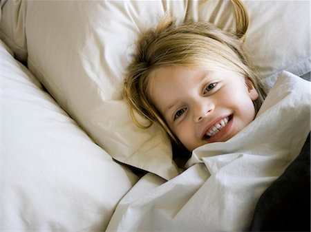 simsearch:640-03257488,k - USA, Utah, Provo, Portrait of girl (4-5) lying in bed Stock Photo - Premium Royalty-Free, Code: 640-03257581