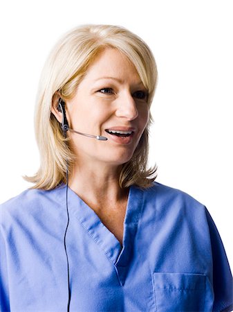 simsearch:640-03257612,k - Female nurse using headset, studio shot Stock Photo - Premium Royalty-Free, Code: 640-03257605