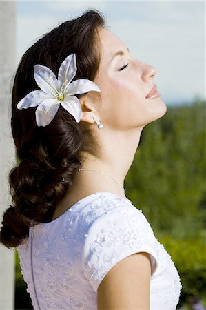 Woman posing in garden Stock Photo - Premium Royalty-Free, Code: 640-03257786