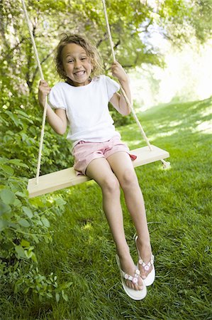 Girl on a swing Stock Photo - Premium Royalty-Free, Code: 640-03257898