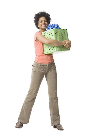 Woman holding gift box Stock Photo - Premium Royalty-Free, Code: 640-03258021