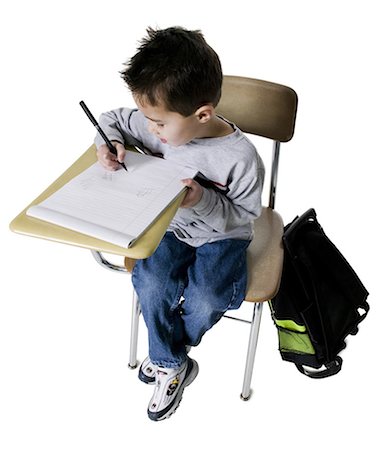 simsearch:695-03387274,k - Schoolboy at desk Fotografie stock - Premium Royalty-Free, Codice: 640-03258314