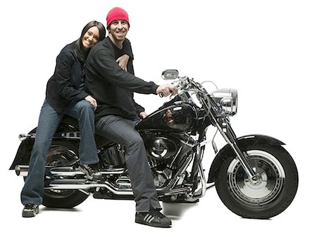 Man and woman posing on motorcycle Stock Photo - Premium Royalty-Free, Code: 640-03258319