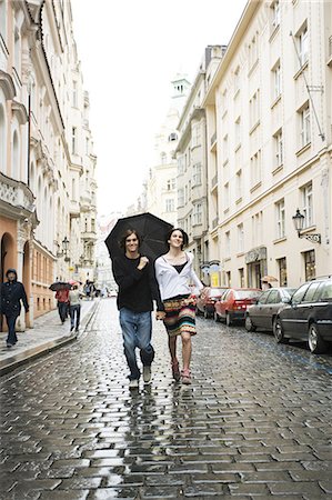 shower teen - Couple in the rain holding hands Stock Photo - Premium Royalty-Free, Code: 640-03258522