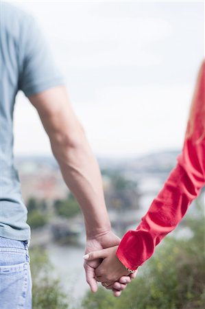 simsearch:640-03259856,k - Couple holding hands Stock Photo - Premium Royalty-Free, Code: 640-03258571