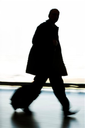 people airports silhouettes - Silhouette of man with bag Stock Photo - Premium Royalty-Free, Code: 640-03258601