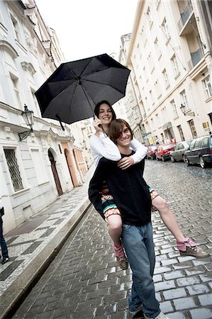 romantic road - Couple with umbrella in the rain Stock Photo - Premium Royalty-Free, Code: 640-03258652