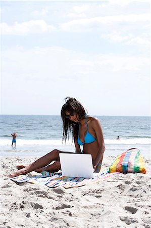 Woman with laptop at the beach Stock Photo - Premium Royalty-Free, Code: 640-03258764