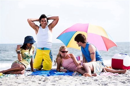simsearch:640-03258825,k - Four adults lying on the beach Stock Photo - Premium Royalty-Free, Code: 640-03258812