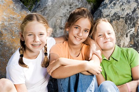 playground friends - Three girls smiling Stock Photo - Premium Royalty-Free, Code: 640-03258834