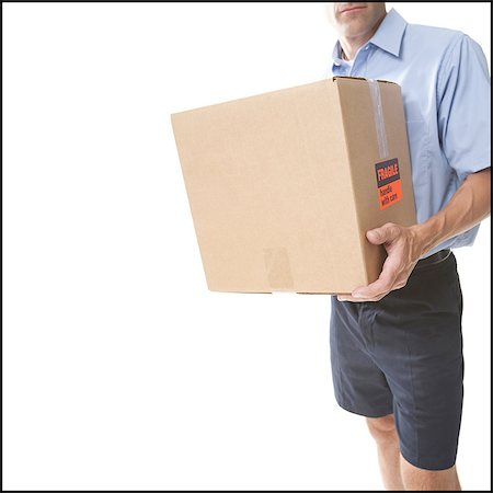 post office - Delivery man with package Stock Photo - Premium Royalty-Free, Code: 640-03258850