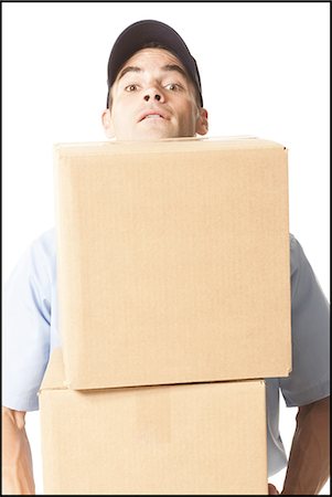 post office - Delivery man with package Stock Photo - Premium Royalty-Free, Code: 640-03258971