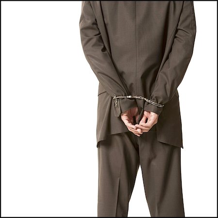 Businessman in handcuffs Foto de stock - Sin royalties Premium, Código: 640-03258988