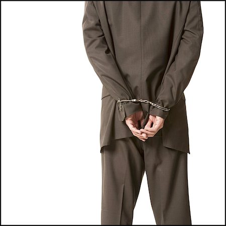 Businessman in handcuffs Stock Photo - Premium Royalty-Free, Code: 640-03258988