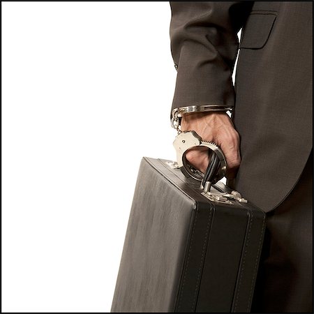 simsearch:640-02950942,k - Businessman handcuffed to a briefcase Foto de stock - Sin royalties Premium, Código: 640-03258980