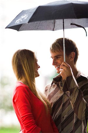 simsearch:640-03259856,k - Couple with umbrella in the rain Stock Photo - Premium Royalty-Free, Code: 640-03259215