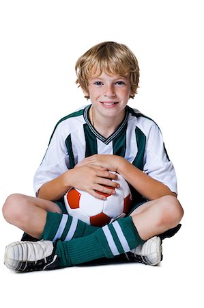 preteen boy happy white background - Soccer player Stock Photo - Premium Royalty-Free, Code: 640-03259278