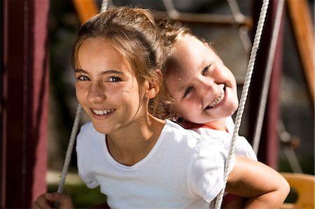 Girls swinging Stock Photo - Premium Royalty-Free, Code: 640-03259300