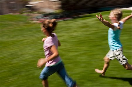Three girl friends running outside Stock Photo - Premium Royalty-Free, Code: 640-03259344