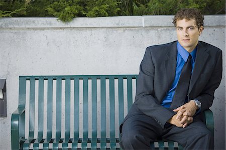 Businessman sitting on a bench Stock Photo - Premium Royalty-Free, Code: 640-03259461