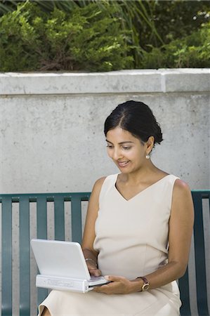 Woman on laptop Stock Photo - Premium Royalty-Free, Code: 640-03259516