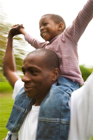 Father and son playing outside Stock Photo - Premium Royalty-Free, Code: 640-03259616