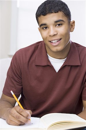 Teenage boy studying Stock Photo - Premium Royalty-Free, Code: 640-03259627