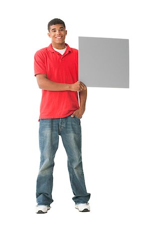 Teenage boy with blank sign Stock Photo - Premium Royalty-Free, Code: 640-03259654