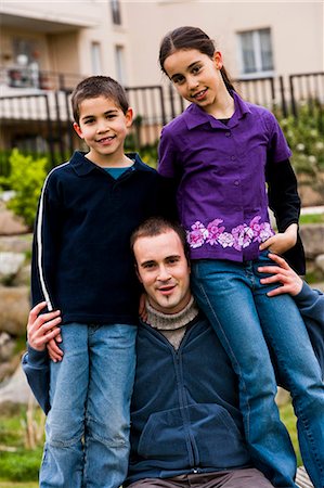 Father with two kids outside Stock Photo - Premium Royalty-Free, Code: 640-03259734