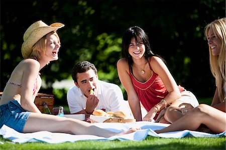 people eating at picnic - Friends having a picnic Stock Photo - Premium Royalty-Free, Code: 640-03259821