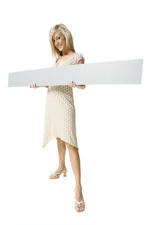 Woman with blank sign Stock Photo - Premium Royalty-Free, Code: 640-03259890
