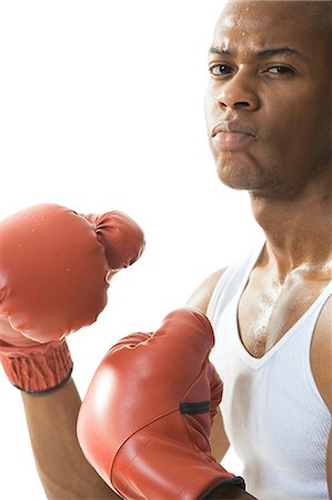 sweaty fighter - Man wearing boxing gloves Stock Photo - Premium Royalty-Free, Code: 640-03259923