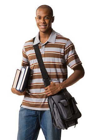 Teenage boy with bookbag and books Stock Photo - Premium Royalty-Free, Code: 640-03259948