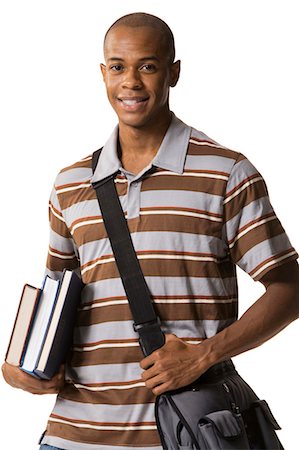 Teenage boy with bookbag and books Stock Photo - Premium Royalty-Free, Code: 640-03259949