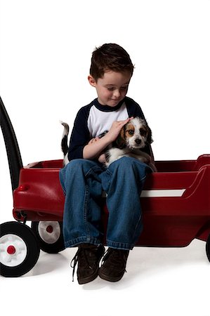 simsearch:640-01355830,k - Boy with puppy and toy wagon Stock Photo - Premium Royalty-Free, Code: 640-03264424