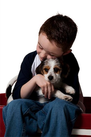 simsearch:640-01355830,k - Boy with puppy and toy wagon Stock Photo - Premium Royalty-Free, Code: 640-03264425